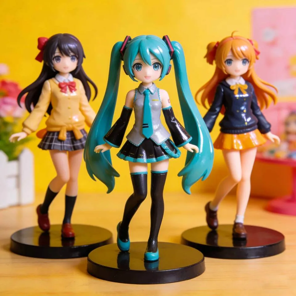 Three anime-style PVC figures displayed as a coordinated character trio with bright hair and school-uniform styling